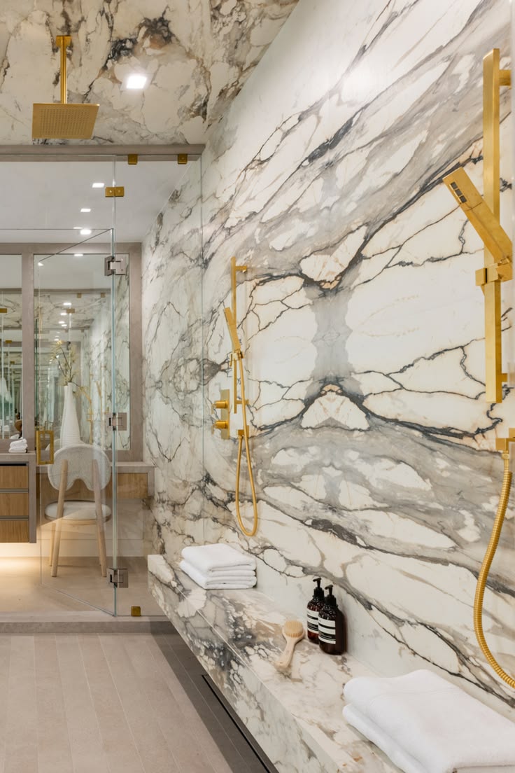 Completed bookmatched marble shower wall design